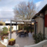 Pergola bioclimatique 10,80m² alu gris + toit avec lames écru HABRITA